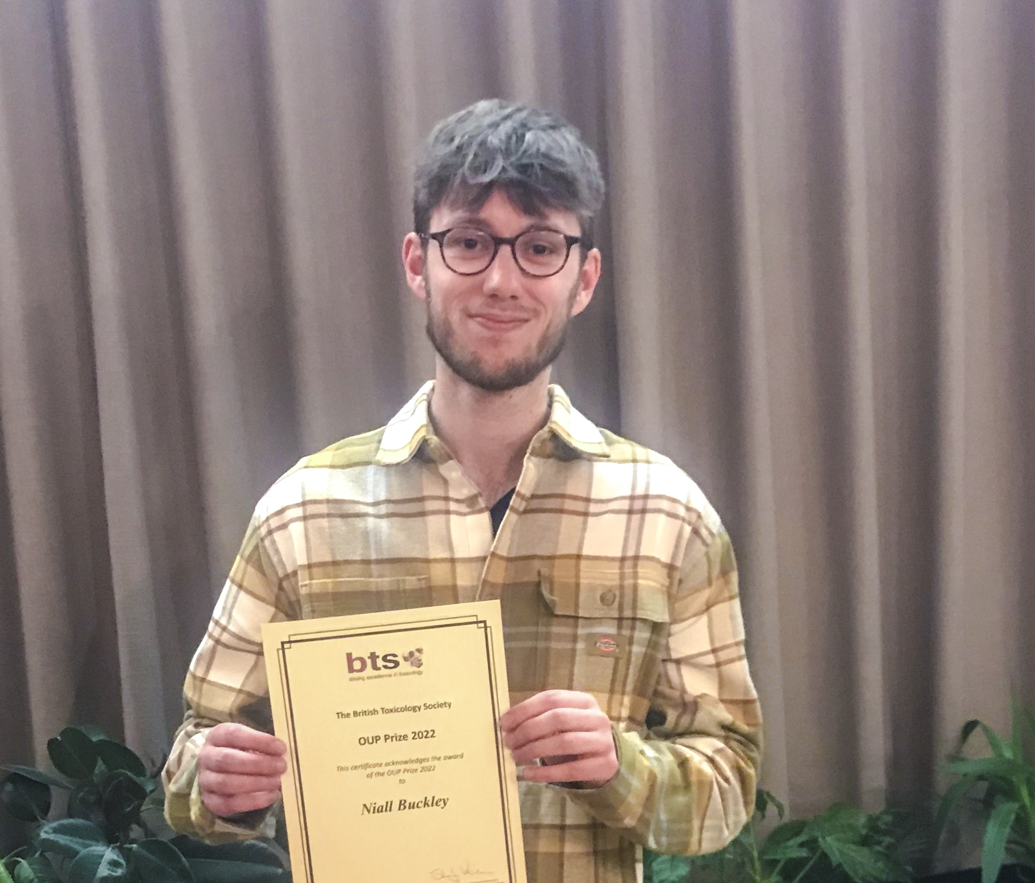 Niall holding his BTS prize certificate