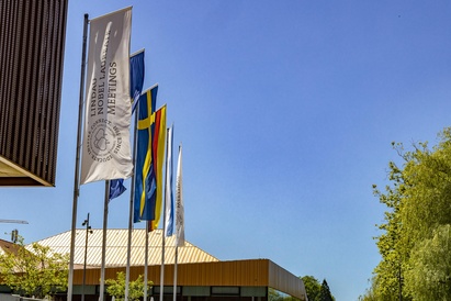 Six flags blow in the wind outside the 74th Lindau Nobel Laureate Meeting in Chemistry, source: Lindau Nobel Flickr 