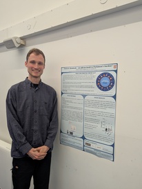 Rob Bradley stands by his poster at the Dementia and Parkinson's Disease Open Day