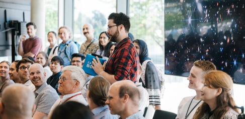 David asking a question during an Agora session with Reinhard Genzel, Physics 2020, source: Lindau Nobel Flickr 