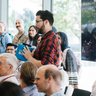 David asking a question during an Agora session with Reinhard Genzel, Physics 2020, source: Lindau Nobel Flickr 