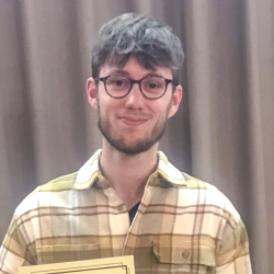 Niall holding his BTS prize certificate